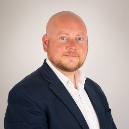 Man in suit looking into the camera